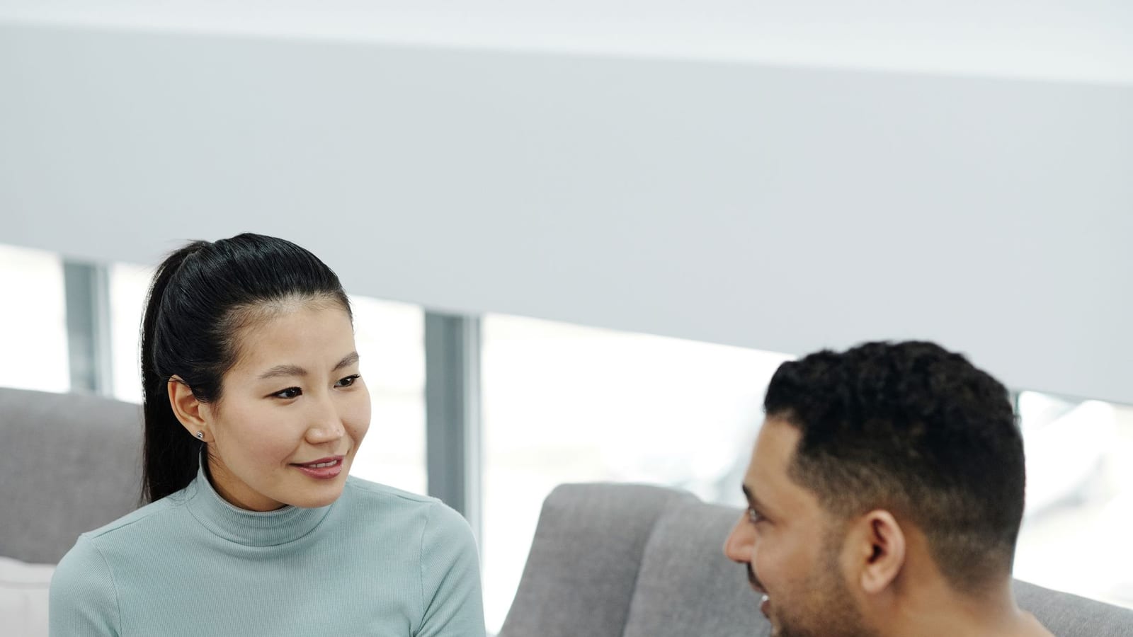 Patient talking with a healthcare provider during a consultation in a bright clinic